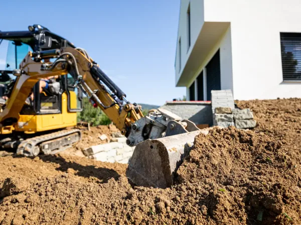 mini-excavator-digging-preparing-ground-under-home-2026-03-10-22-27-23-utc