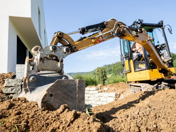mini-excavator-digging-preparing-ground-under-home-2026-03-10-22-30-10-utc