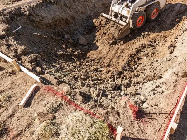 small-bulldozer-digging-in-yard-for-pool-installat-2026-03-09-03-26-25-utc